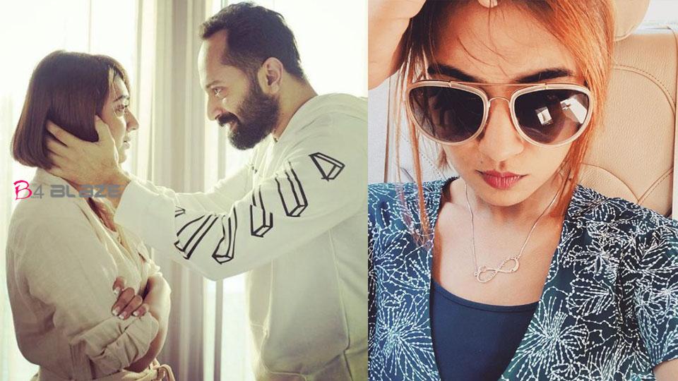 Nazriya wearing a locket with the name of Fahadh and another one